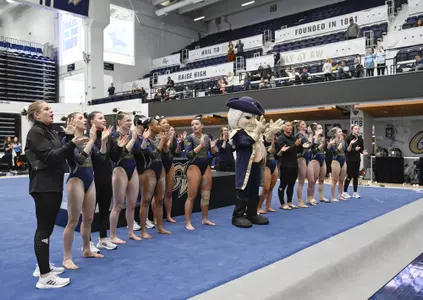 Gymnastics team sings the fight song