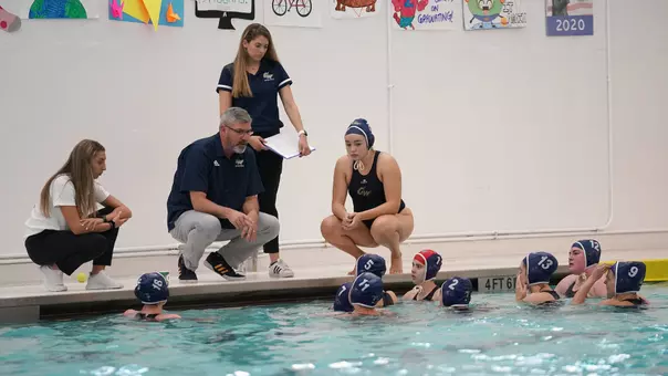 GW Women's Water Polo huddles during a break vs. Princeton on Feb. 29, 2020.