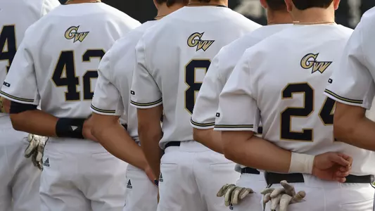 GW baseball stands for the national anthem.