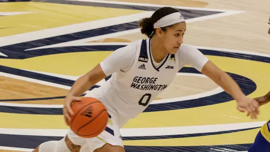 Jasmine Whitney drives the ball.