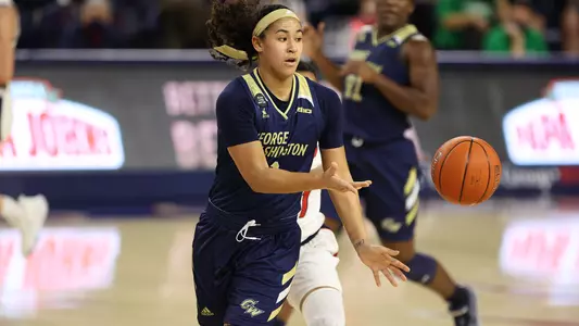 Jasmine Whitney shovels a pass.