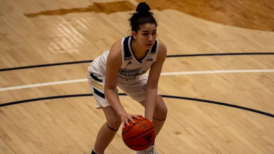 Aurea GIngras dribbles prior to shooting a free throw.