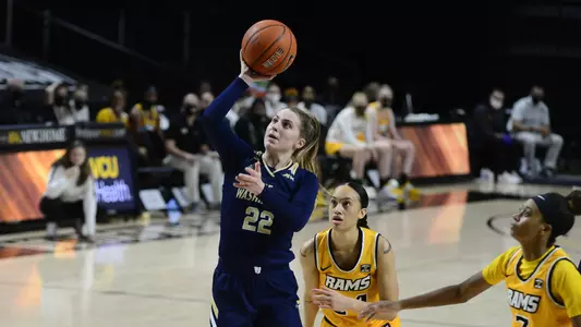 Maddie Loder leans in to shoot.