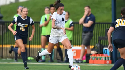 Kelly Amador Dribbles Against UNCG
