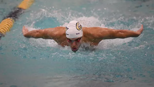 Durde Matic swims 100 fly vs. Virginia Tech.