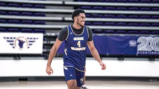 Ricky Lindo Jr. laughs at a preseason practice.