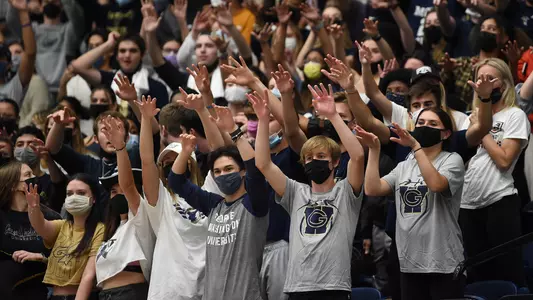 Members of George's Army cheer during men's basketball's season-opening win over Saint Francis.