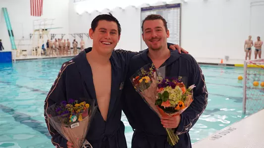 Zachary Pendolino and Andras Levai are honored during Senior Day festivities at Smith Center Pool.