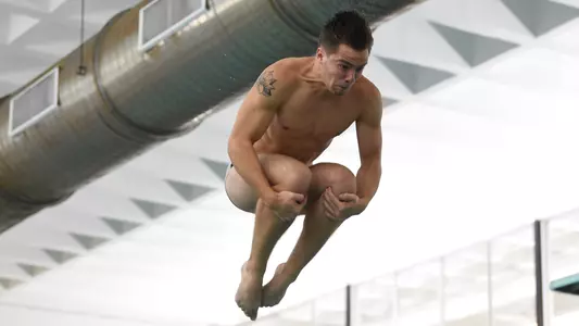 Spencer Bystrom dives vs. Virginia Tech.