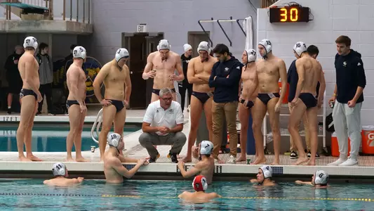 Head Coach Barry King talks with his team during its MAWPC Championship semifinal vs. Navy.