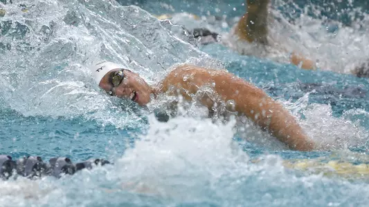 Tyler Kawakami swims vs. Virginia Tech.