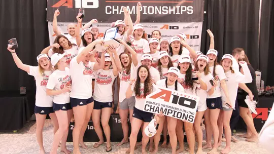 GW women's swimming and diving celebrates its championship.