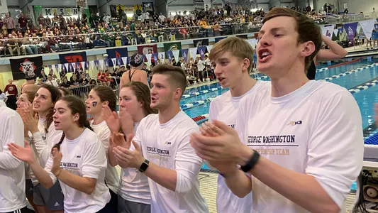 GW swimming and diving cheers at 2020 A-10 Championships.