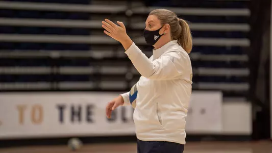 Head coach Sarah Bernson instructs her team