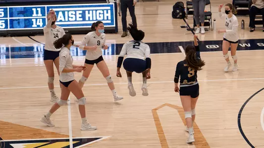 Volleyball celebrates a five-set comeback over Howard