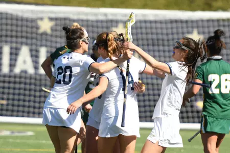 Lacrosse celebrates after a goal