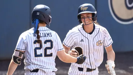Jessica Linquist high-fives Alexa Williams after scoring vs. Saint Louis.