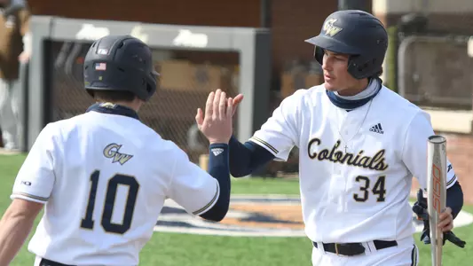 Derek Ripp and Steve DiTomaso high-five.
