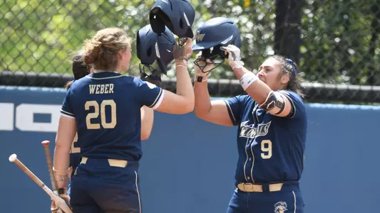 Alessandra Ponce is greeted by her teammates after a home run vs. Dayton.
