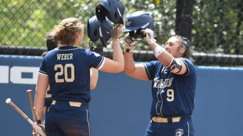 Alessandra Ponce is greeted by her teammates after a home run vs. Dayton.