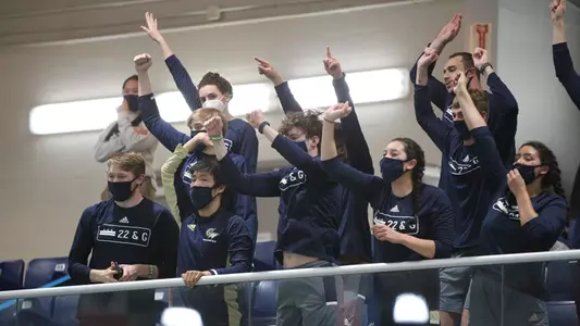 GW swimming & diving cheers at the 2021 A-10 Championships.