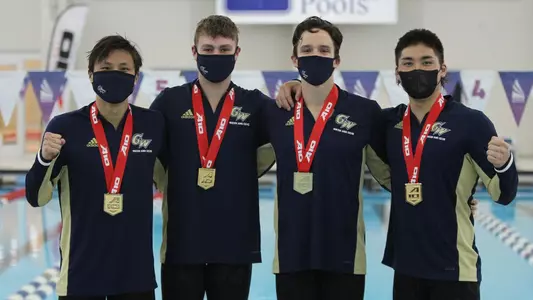 Dylan Koo, Karol Mlynarczyk, Ethan Tulenko & Tyler Kawakami pose with their 200 free relay gold medals.