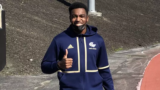 Miles Grant poses after setting two school records at the Towson Invite