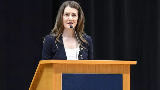 Coach McCombs addresses the crowd at the Charles E. Smith Center
