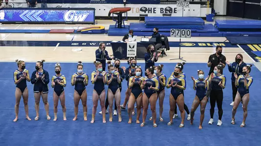 Gymnastics sings fight song following meet