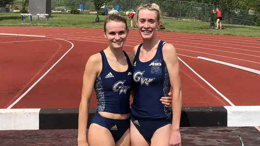 Margaret Coogan and Kathryn Nohilly celebrate breaking the school record