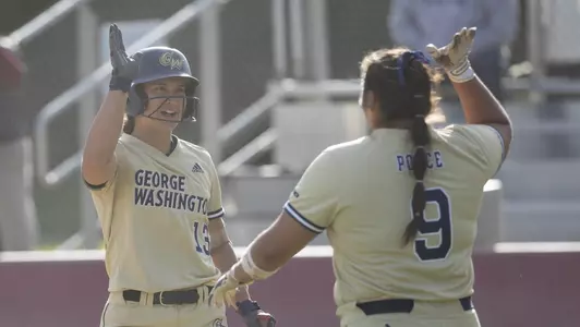 Sierra Lange and Alessandra Ponce share a high-five.
