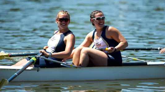 Women's rowing celebrates on the water