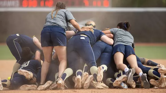 GW softball celebrates its A-10 Championship title.