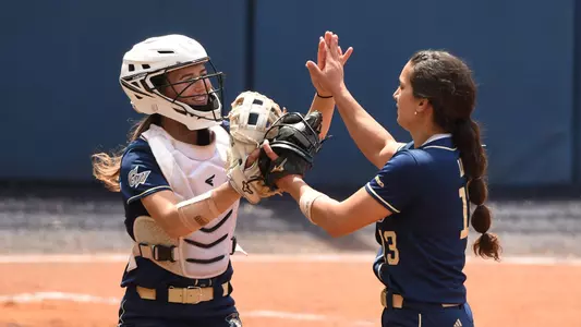 Jessica Linquist and Sierra Lange share a high-five.