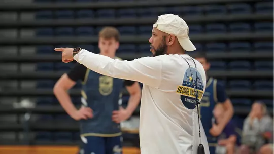 Jamion Christian coaches at a summer practice.