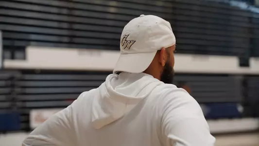 Jamion Christian looks on during summer workouts