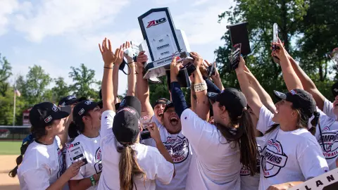 GW softball celebrates its 2021 A-10 Championship.