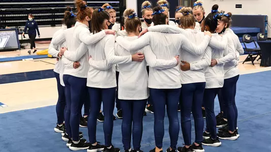 Gymnastics huddles at Lindsey Ferris