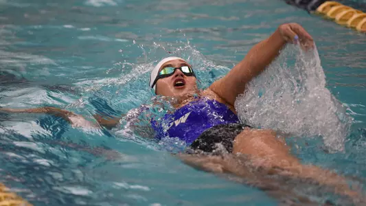 Andrea Moussier swims backstroke vs. Virginia Tech.