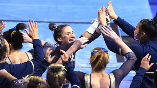 Olivia Zona high fives teammates