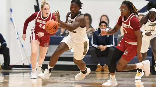 Mayowa Taiwo dribbles against UMass