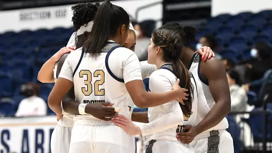 GW Women's Basketball huddles up against UMass