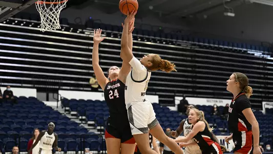 Taylor Webster goes to the hoop against Davidson