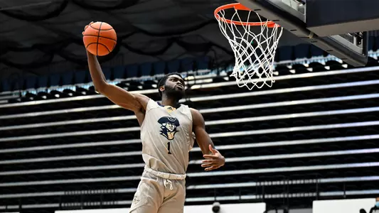 Joe Bamisile skies for a dunk.