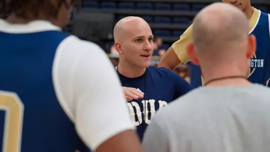 Chris Caputo coaches practice