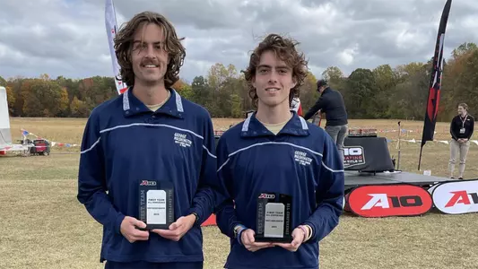 Ryan Fowkes and Michael Bohlke are presented with their All-Conference awards at the 2022 A-10 Championship