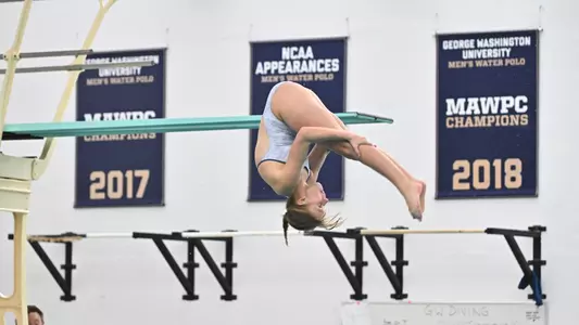 Women's diving mid-dive in the air