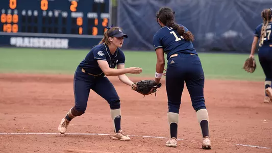 Daniella Wilson high-fives Sierra Lange.