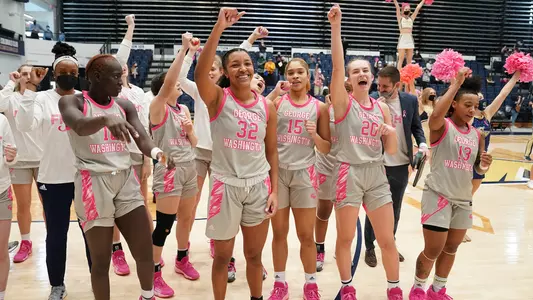 GW Women's Basketball celebrates after a home win over St. Bonaventure in the 2022 Pink Game
