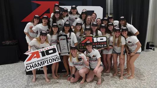 GW women's swimming & diving celebrates its 2022 A-10 title.